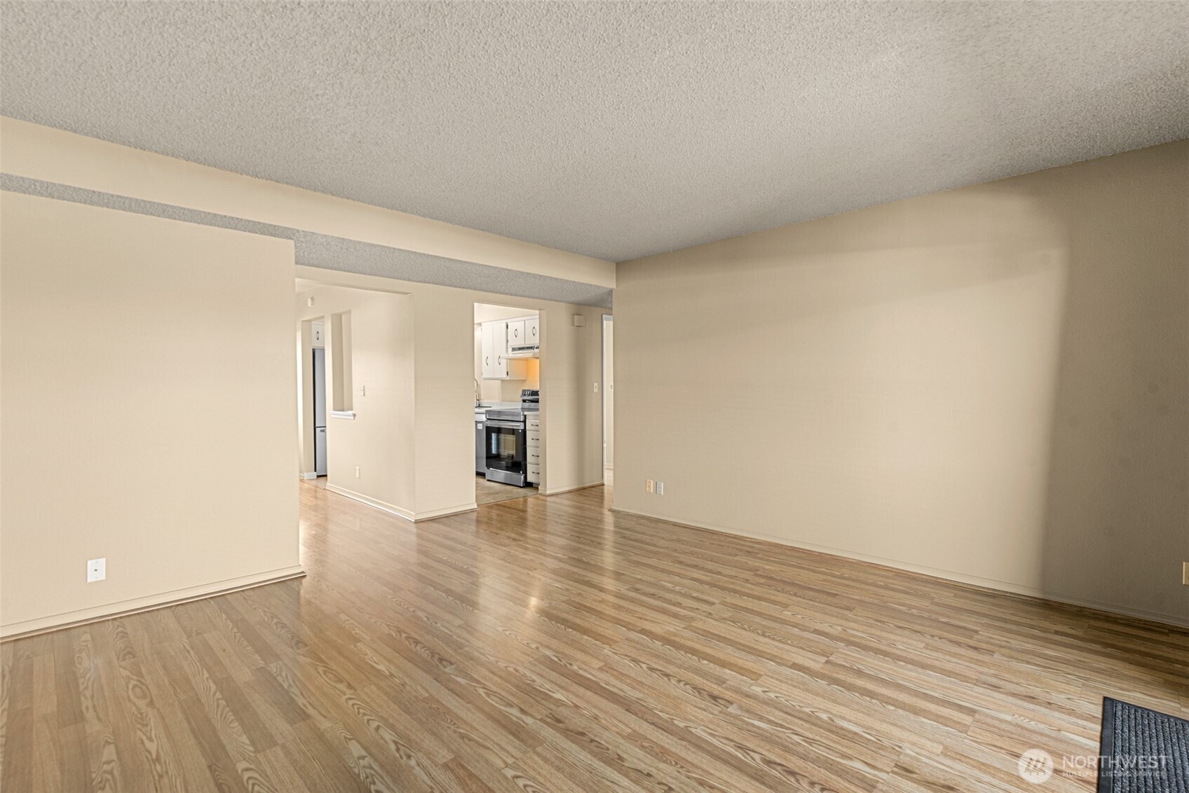 407 Oregon Street, Unit 231 Wenatchee, WA 98801 - Photo 8 of 31 a view of an empty room and wooden floor and closet