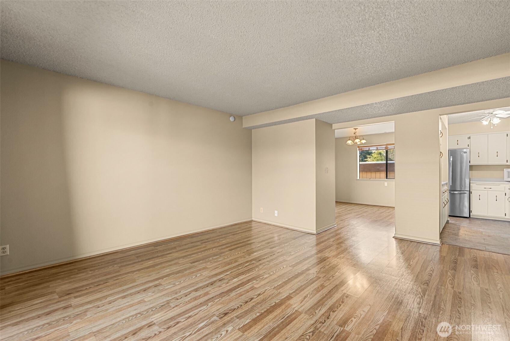 407 Oregon Street, Unit 231 Wenatchee, WA 98801 - Photo 9 of 31 a view of an empty room and wooden floor