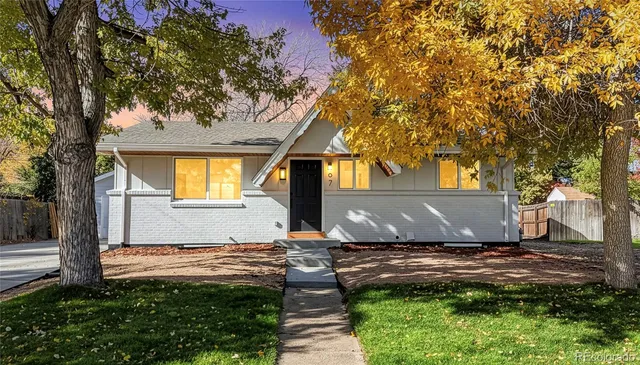 a view of house with backyard