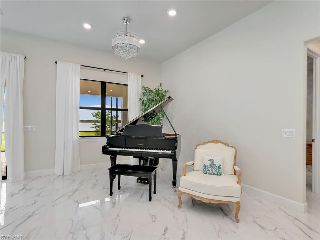 19724 Aqua View Lane Fort Myers, FL 33913 - Photo 12 of 44 a living room with furniture and a piano