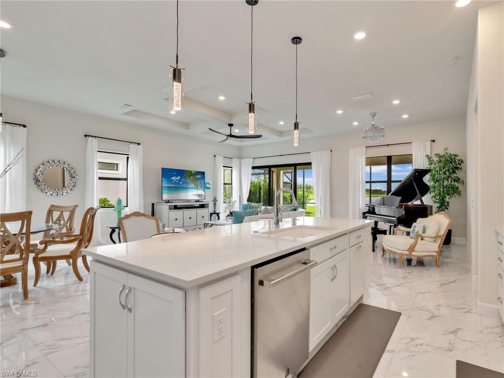 19724 Aqua View Lane Fort Myers, FL 33913 - Photo 44 of 44 a view of living room with granite countertop furniture and a chandelier