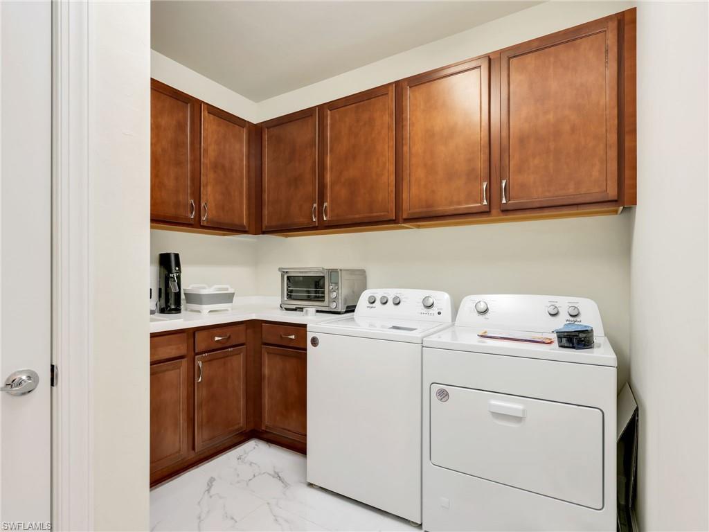 19724 Aqua View Lane Fort Myers, FL 33913 - Photo 27 of 44 a utility room with dryer and washer