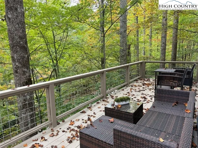 a view of balcony with furniture