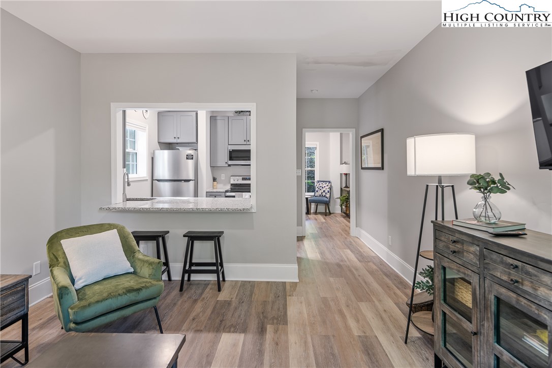 170 Inn At Crestwood Drive Boone, NC 28607 - Photo 24 of 33 a view of a dining room with furniture and wooden floor