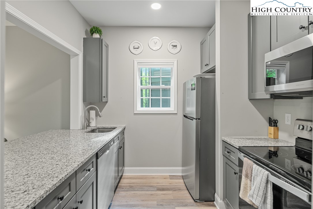 170 Inn At Crestwood Drive Boone, NC 28607 - Photo 26 of 33 a kitchen with stainless steel appliances granite countertop a refrigerator and a sink
