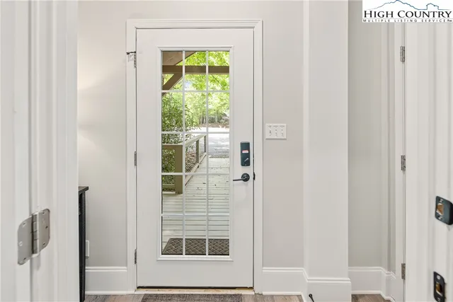 a view of a door and a window