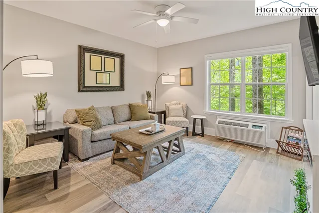a living room with furniture and a window