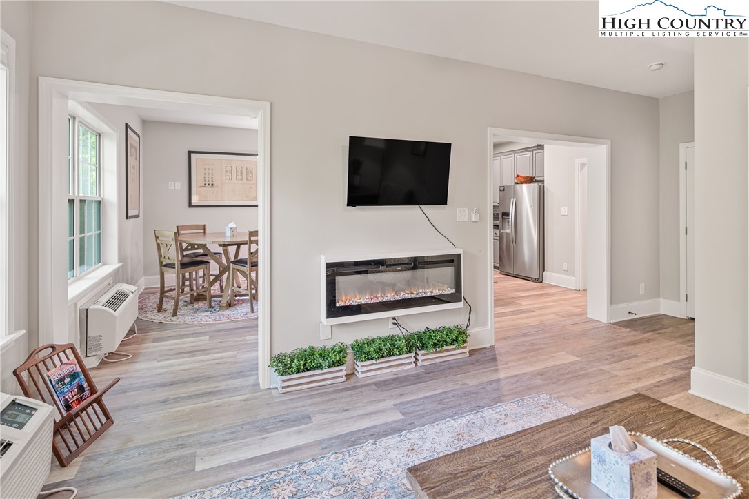 170 Inn At Crestwood Drive Boone, NC 28607 - Photo 7 of 33 a living room with furniture and a flat screen tv
