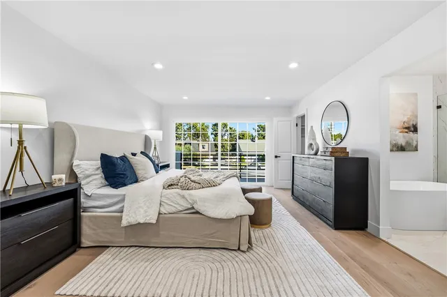 a bedroom with a bed and a dresser