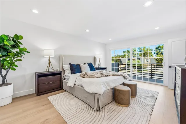 a spacious bedroom with a bed and a couch