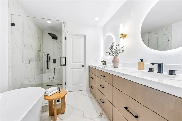 a bedroom with bed and a chair