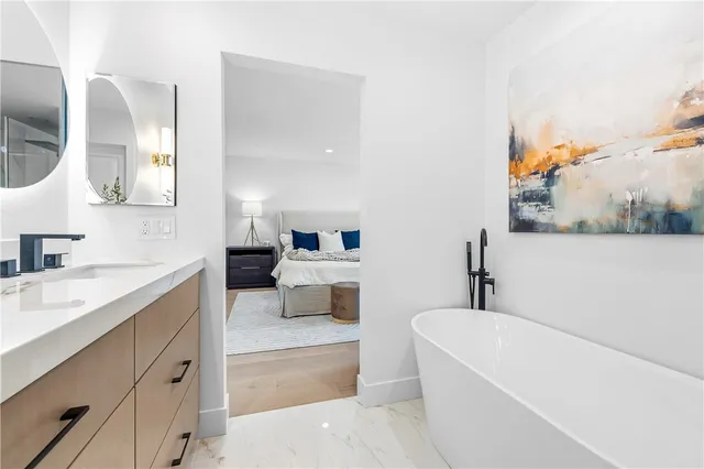 a bedroom with bed and a window