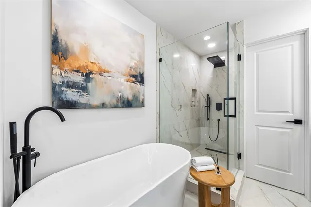 a bedroom with bed and a night stand