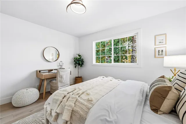 a view of a patio with table and chairs and potted plants