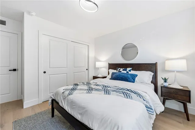 a view of a patio with couches table and chairs and potted plants