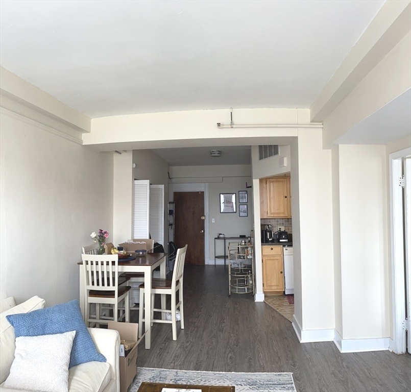 475 Commonwealth Avenue, Unit 601 Boston, MA 02215 - Photo 2 of 13 a view of a dining room with furniture and wooden floor