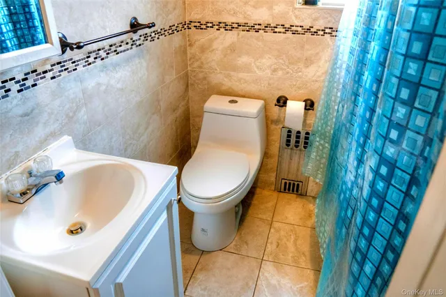 a bathroom with a toilet and a sink