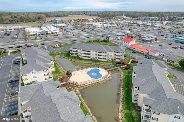 an aerial view of a house with a ocean view