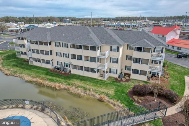 a view of a large building with a yard