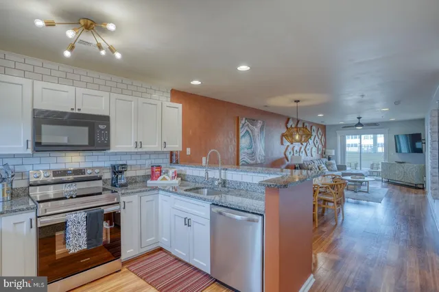 a kitchen with lots of counter top space and appliances