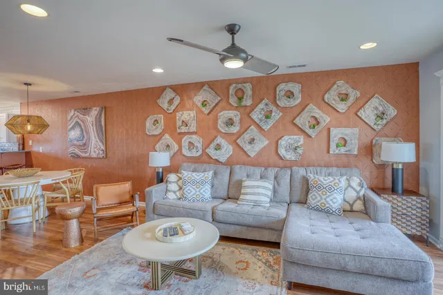 a living room with furniture and a rug