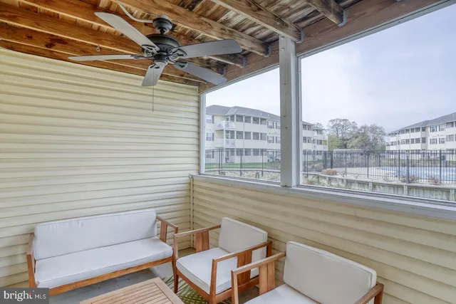 a view of a two chairs in the balcony