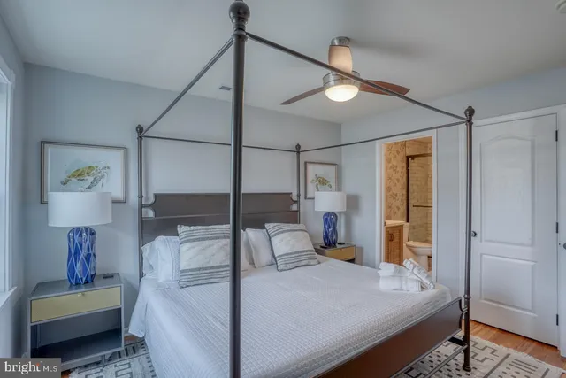 a bedroom with a bed window and walk in closet