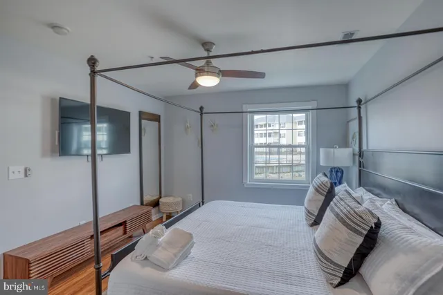 a bed room with a bed and a window