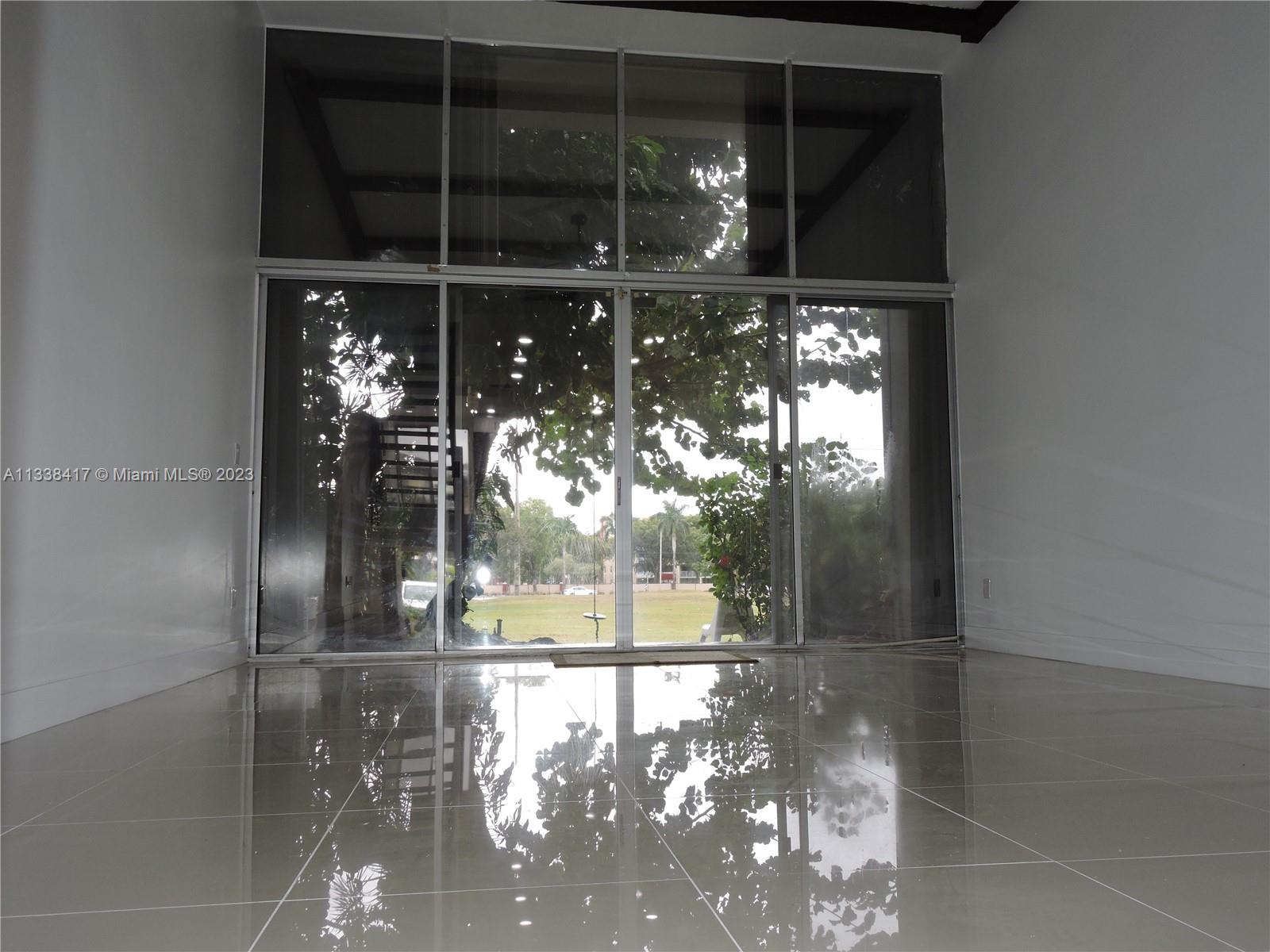 6762 Brookline Drive Hialeah, FL 33015 - Photo 11 of 25 a view of a glass door with a glass door