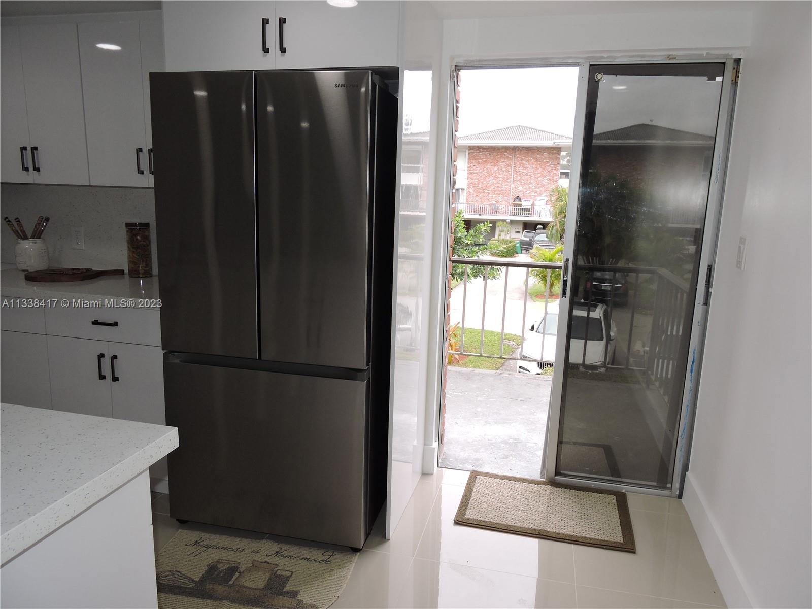 6762 Brookline Drive Hialeah, FL 33015 - Photo 18 of 25 a refrigerator freezer sitting in a kitchen