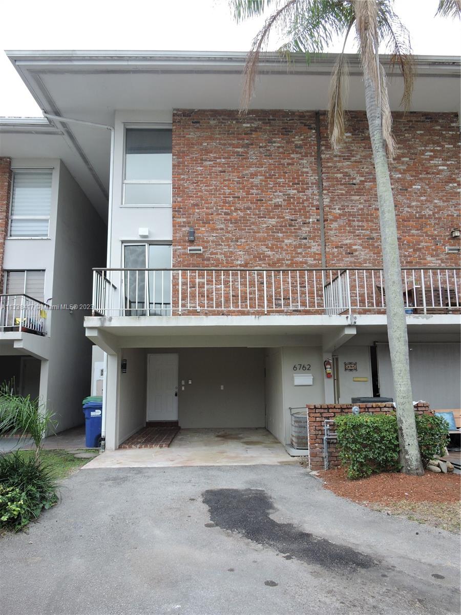 6762 Brookline Drive Hialeah, FL 33015 - Photo 2 of 25 a front view of a building with entryway