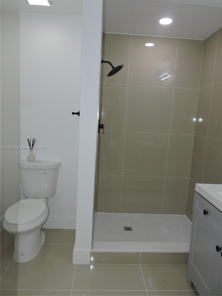6762 Brookline Drive Hialeah, FL 33015 - Photo 24 of 25 a bathroom with a toilet and shower