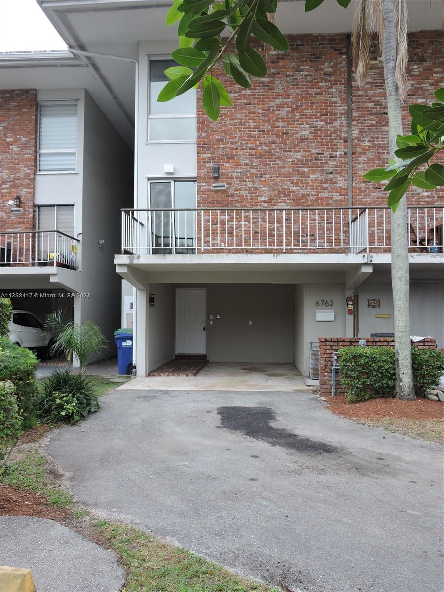 6762 Brookline Drive Hialeah, FL 33015 - Photo 3 of 25 a front view of a house with a yard and garage