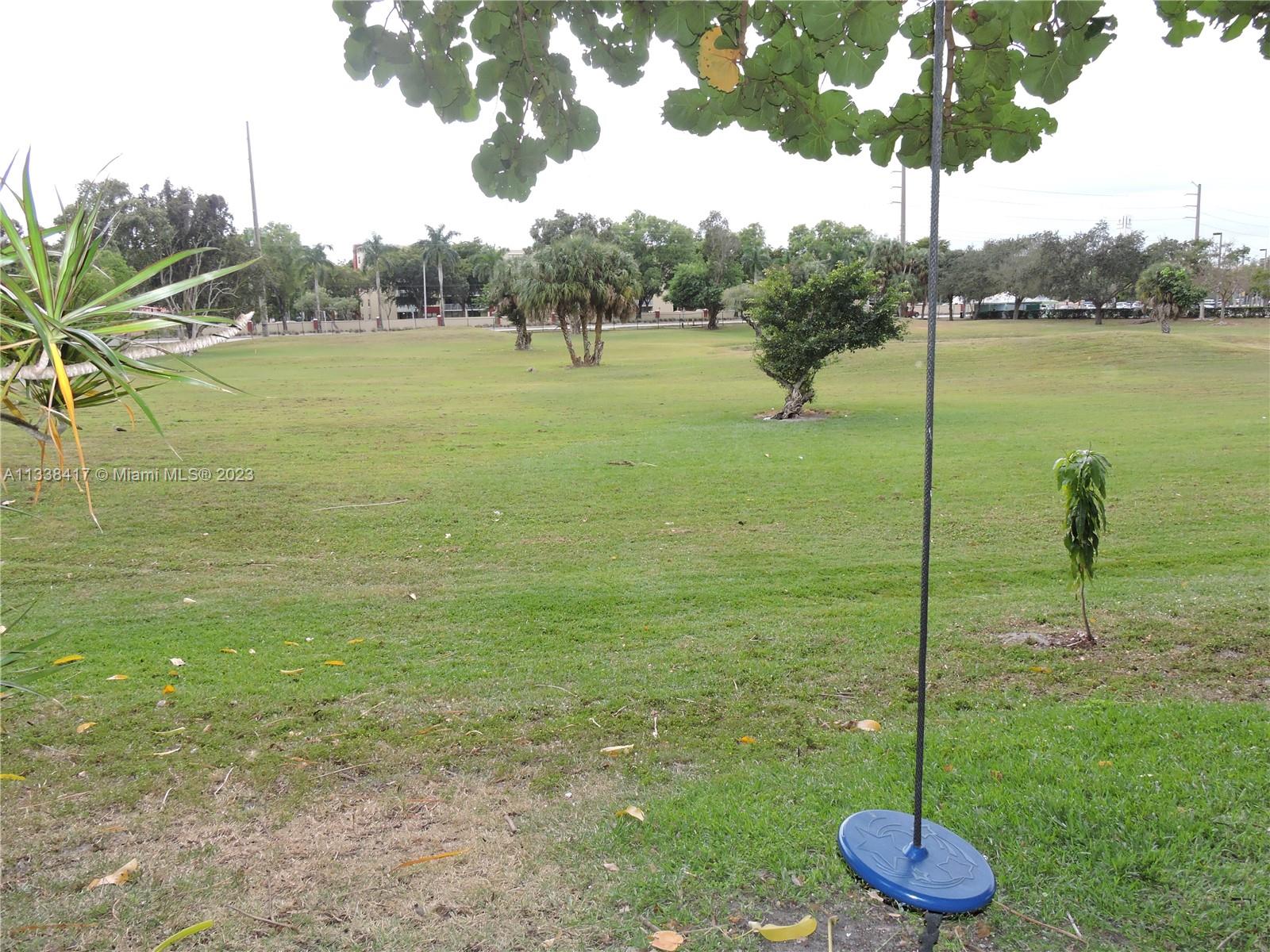 6762 Brookline Drive Hialeah, FL 33015 - Photo 5 of 25 a view of a garden with a lake