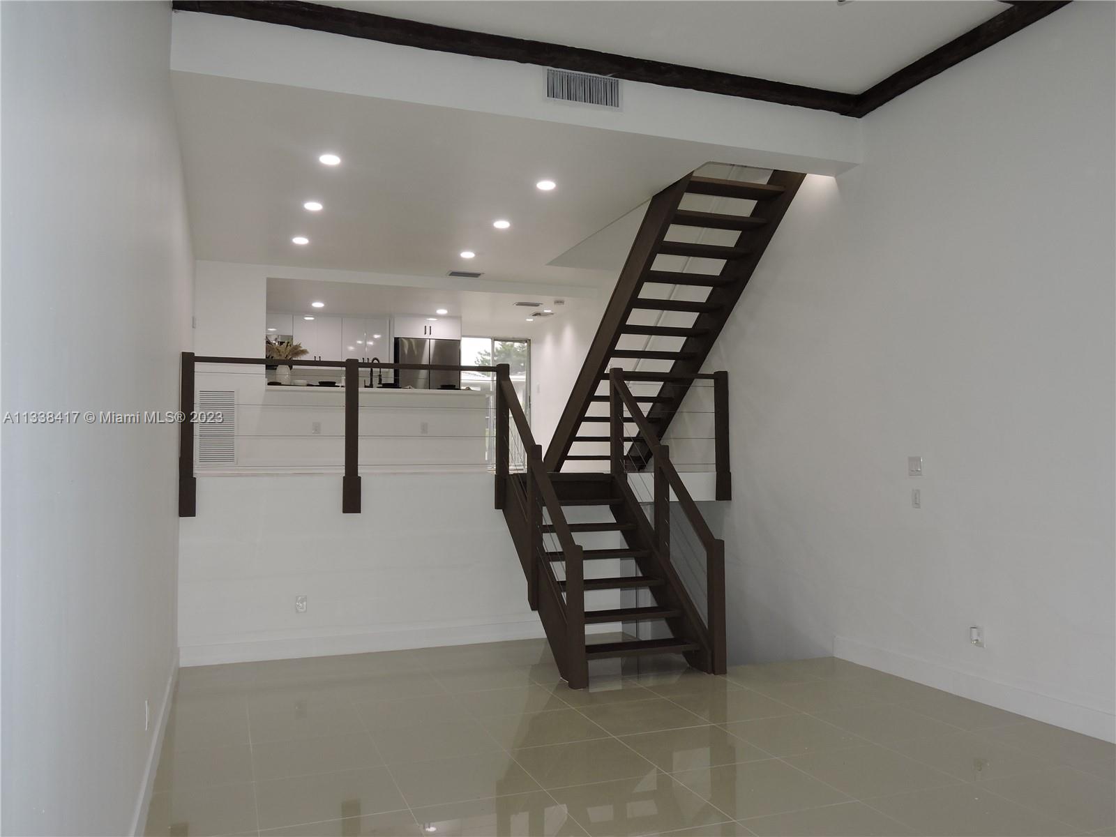 6762 Brookline Drive Hialeah, FL 33015 - Photo 9 of 25 an entryway in a hall with a window