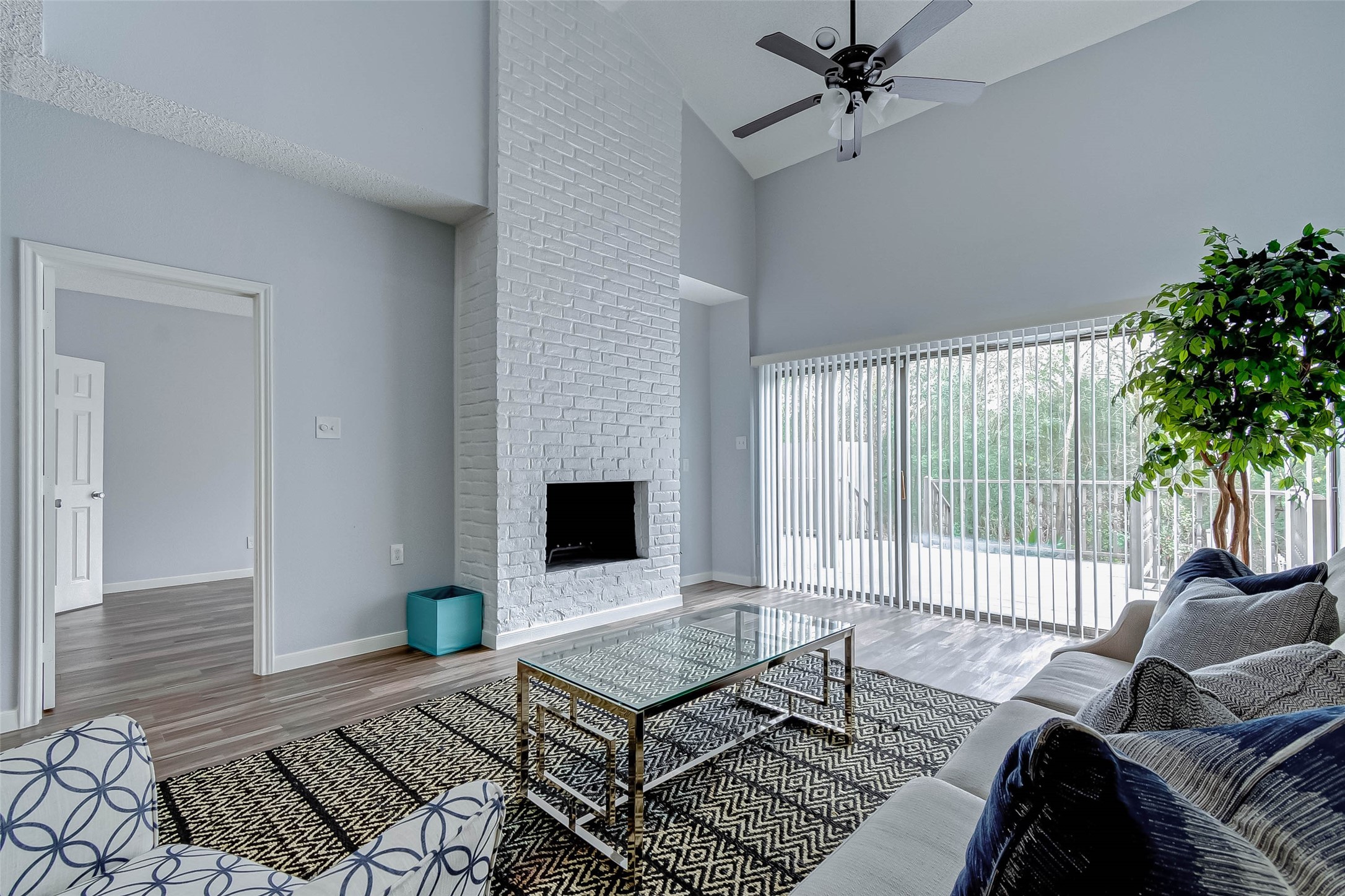 395 Rancho Bauer Drive Houston, TX 77079 - Photo 16 of 50 a living room with furniture and a fireplace