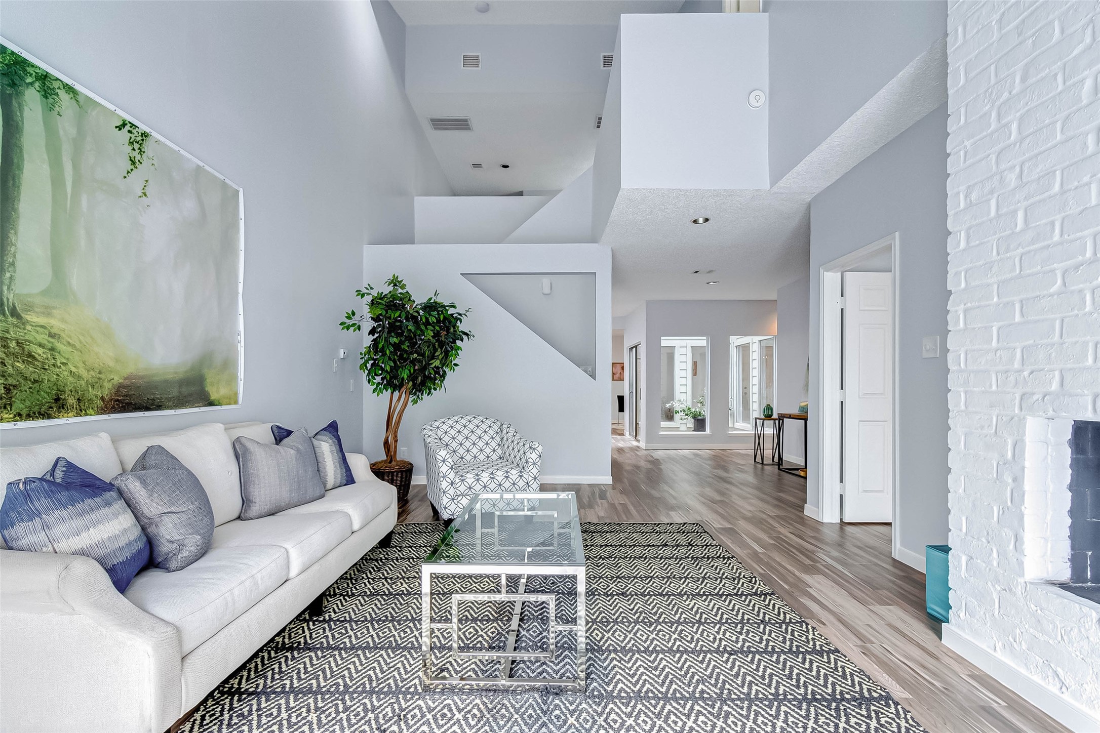 395 Rancho Bauer Drive Houston, TX 77079 - Photo 18 of 50 a living room with furniture and wooden floor