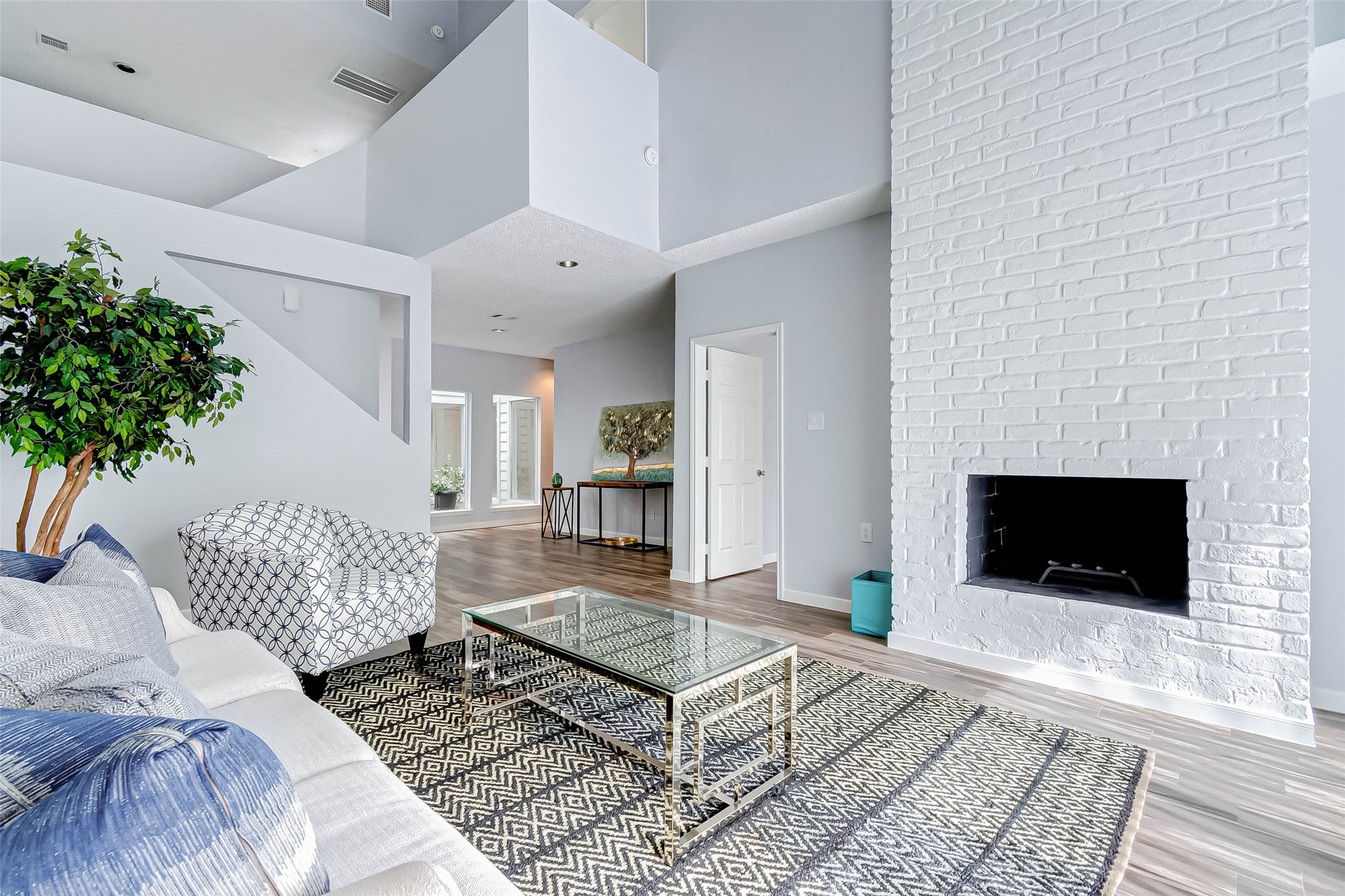 395 Rancho Bauer Drive Houston, TX 77079 - Photo 19 of 50 a living room with furniture and a fireplace