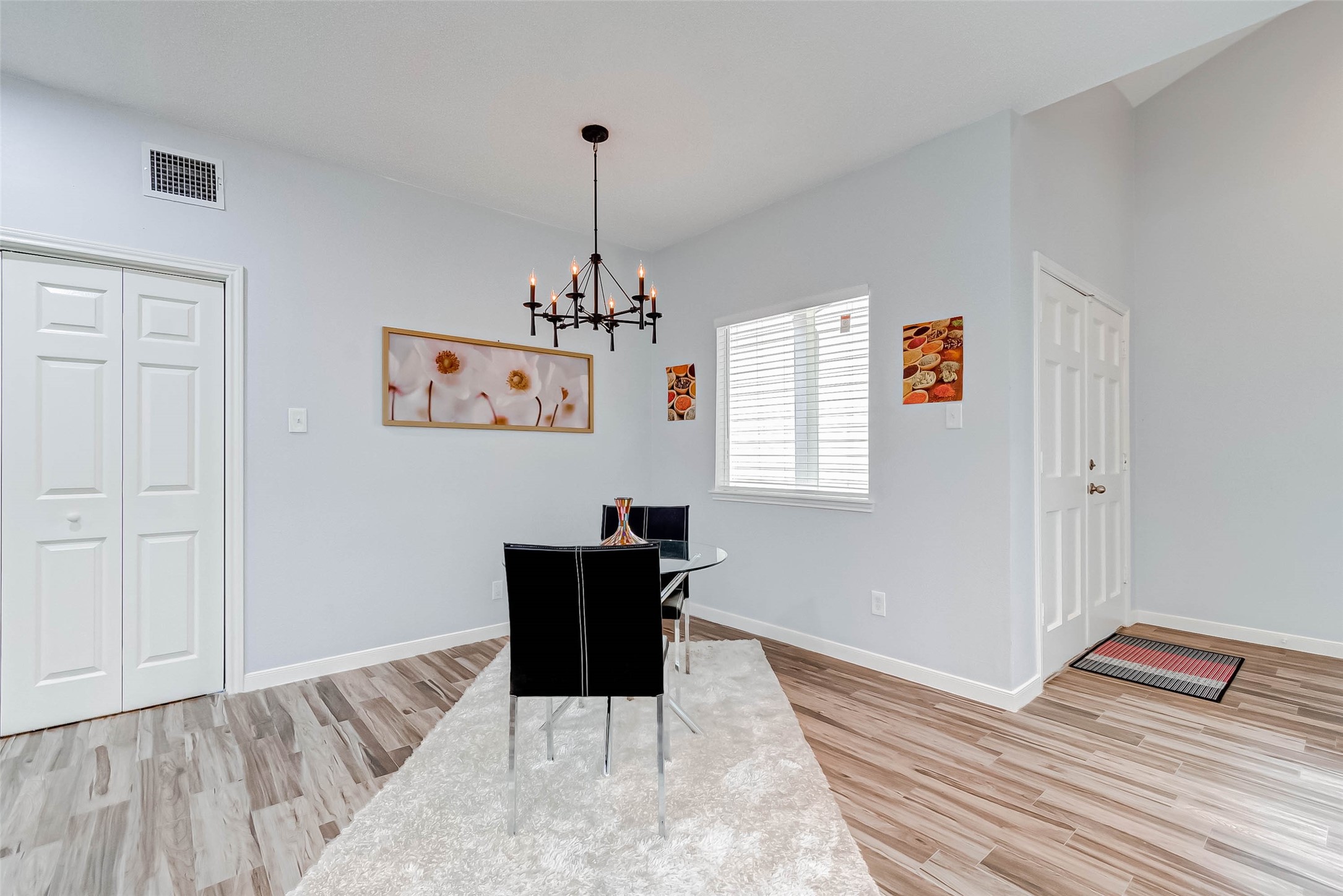 395 Rancho Bauer Drive Houston, TX 77079 - Photo 21 of 50 a bedroom with a bed and wooden floor