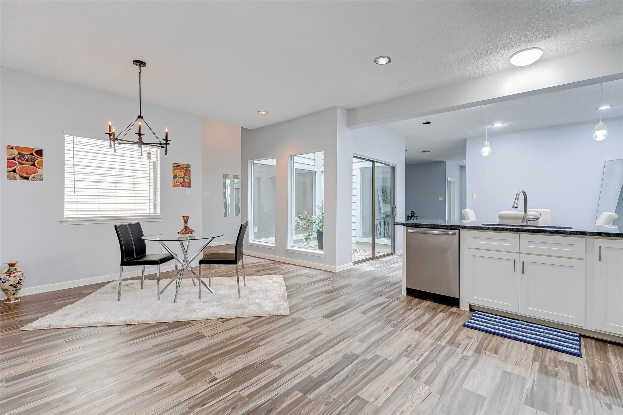 395 Rancho Bauer Drive Houston, TX 77079 - Photo 25 of 50 a view of a dining room with furniture window and wooden floor