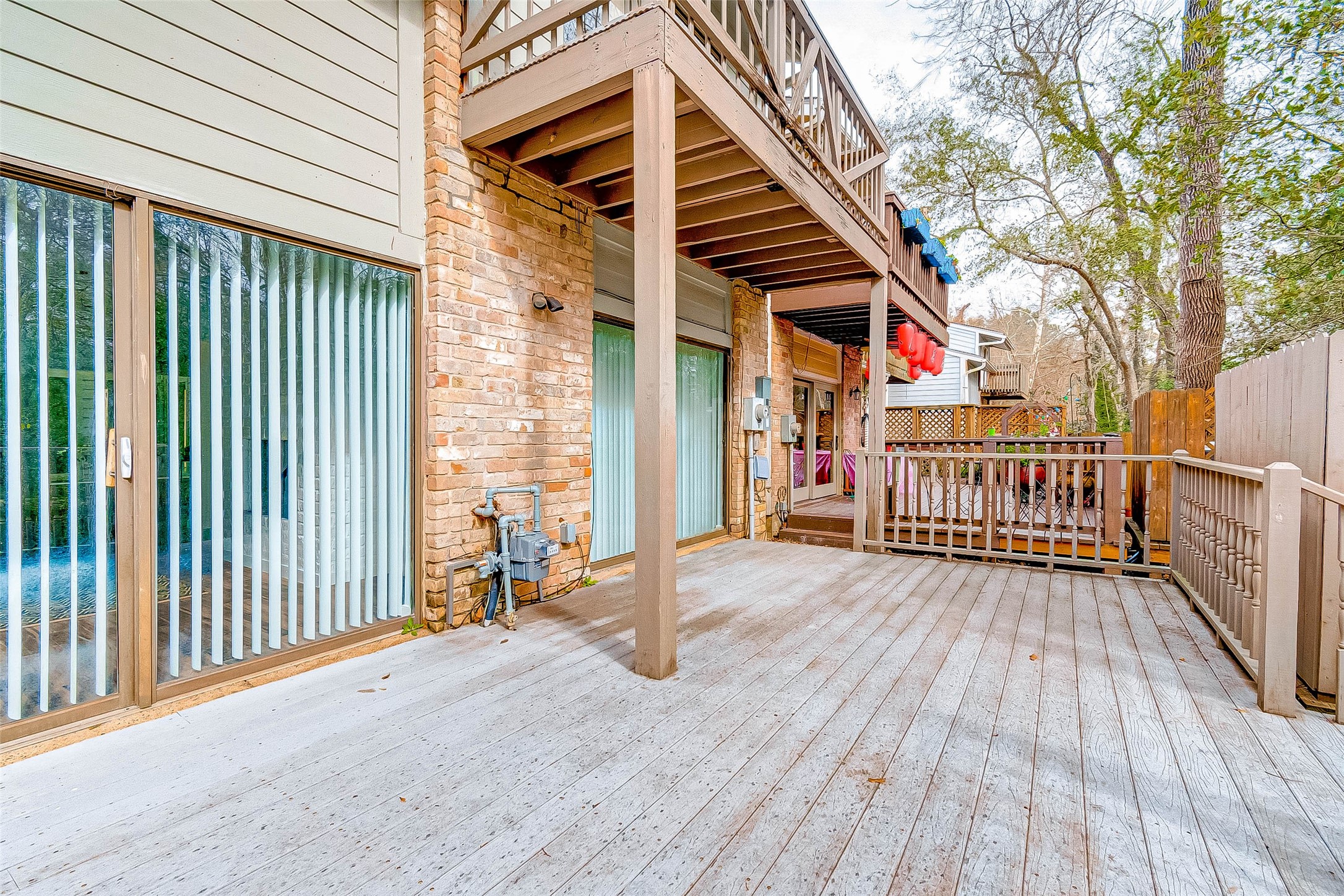 395 Rancho Bauer Drive Houston, TX 77079 - Photo 49 of 50 a view of a house with a wooden deck