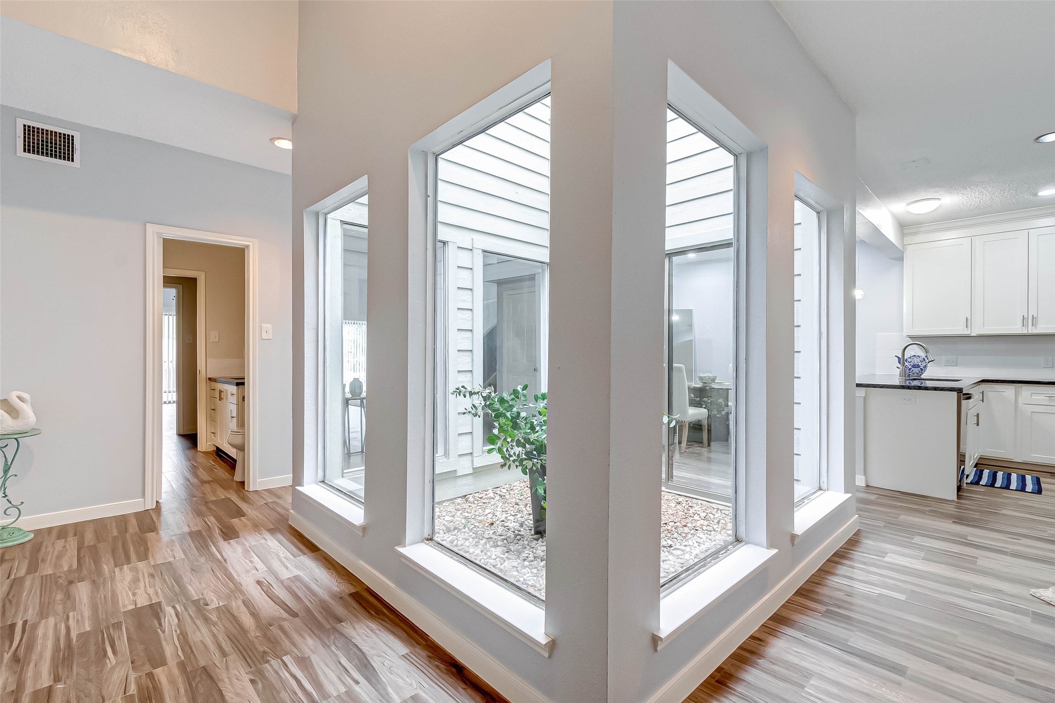 395 Rancho Bauer Drive Houston, TX 77079 - Photo 10 of 50 a view of kitchen with furniture and wooden floor