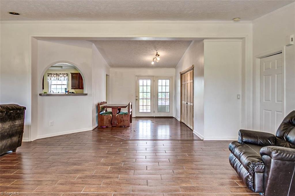 628 Wright Country Road Ramseur, NC 27316 - Photo 3 of 27 Great room has ceramic tile floor that has the look of wood