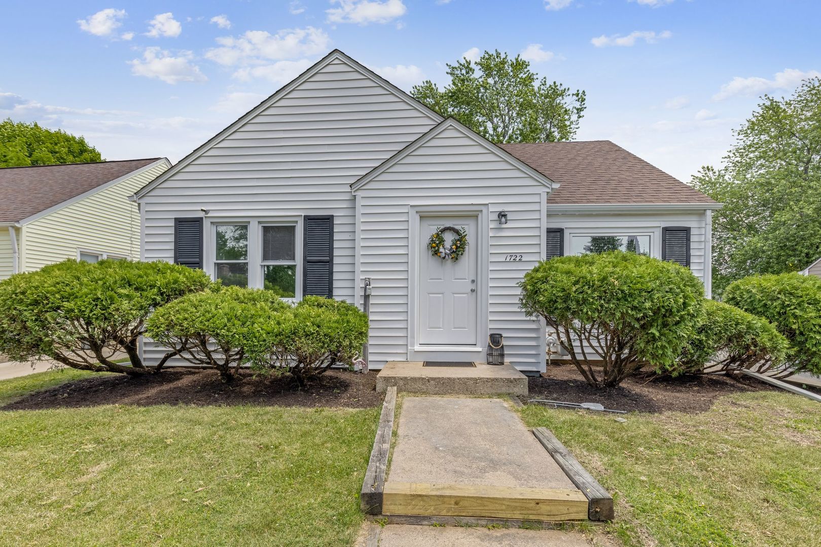 1722 Oregon Avenue Rockford, IL 61108 - Photo 1 of 24 a house view with a garden space