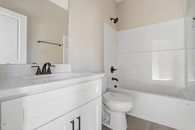a bathroom with a sink a toilet and a bathtub