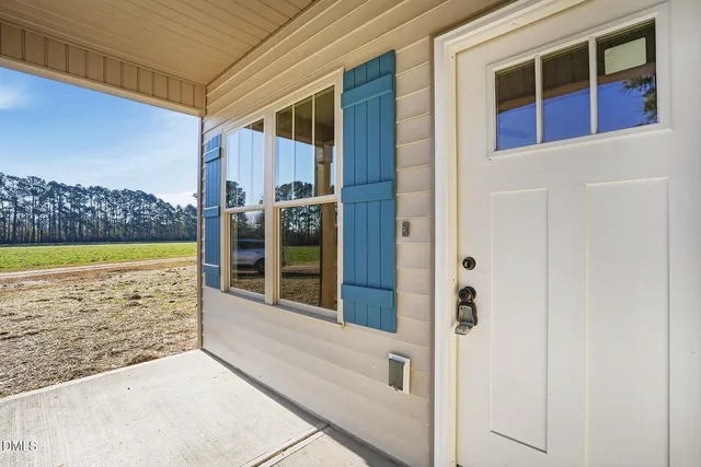 a view of a balcony with door