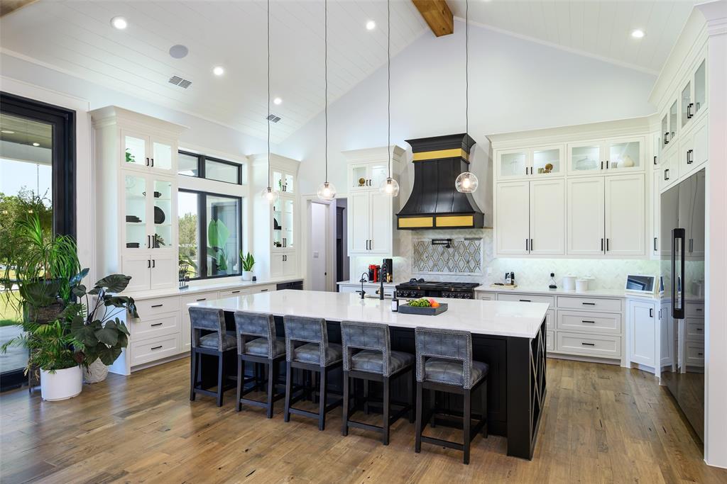 635 Highpoint Road Royse City, TX 75189 - Photo 11 of 35 a large kitchen with a table and chairs
