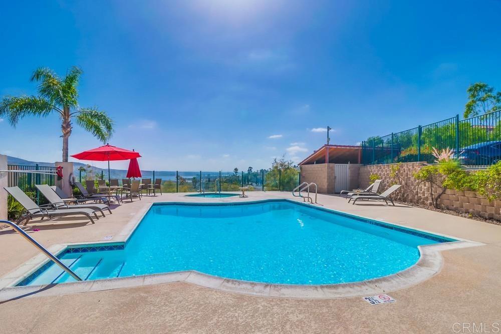 2723 Lake Pointe Drive, Unit 134 Spring Valley, CA 91977 - Photo 1 of 1 a view of a swimming pool and lounge chairs