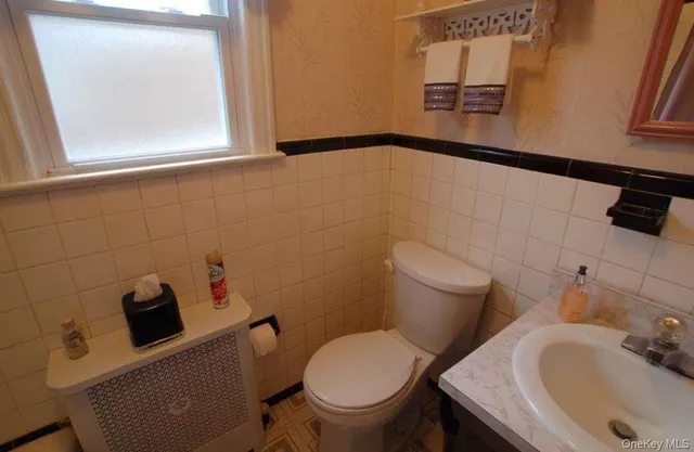 a bathroom with a sink and a toilet