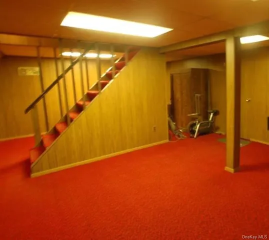 a view of an empty room with stairs